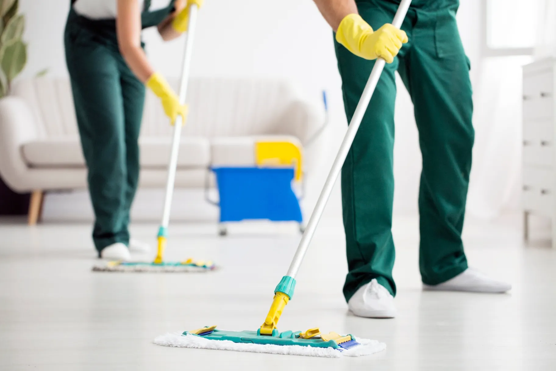 Team deep-cleaning a condominium living room